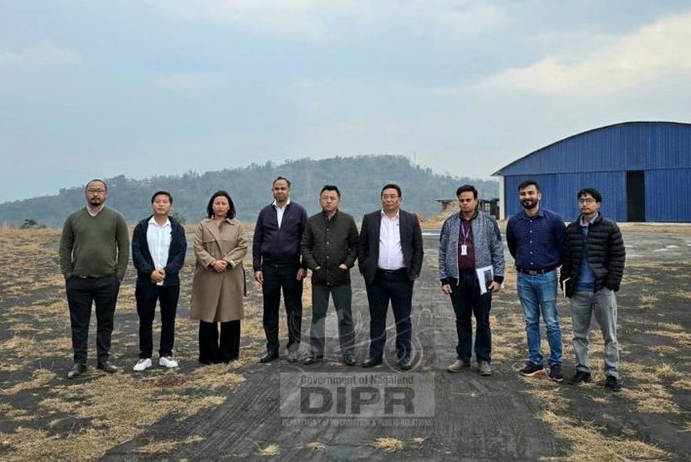 Transport Secretary Robert Longchari with the Pawan Hans in Kohima on February 18. (DIPR Photo)